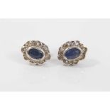 Pair of sapphire and diamond cluster earrings, each with an oval mixed cut blue sapphire surrounded