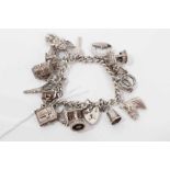 Silver charm bracelet with sixteen silver charms