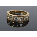 Diamond nine stone ring with a half hoop of nine graduated round brilliant cut diamonds in grain set