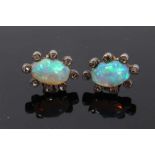 Pair of antique opal and diamond earrings, each with a opal cabochon surrounded by rose cut diamonds