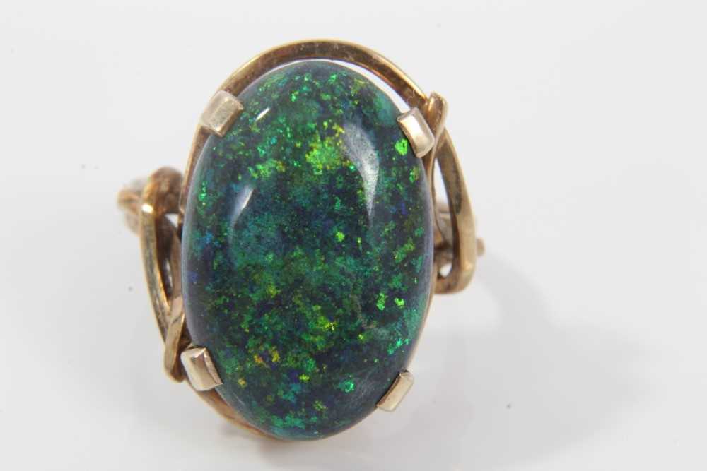 Black opal single stone ring with an oval black opal cabochon measuring approximately 20mm x 13mm x - Image 5 of 7