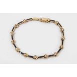 18ct Gold (stamped 750) bracelet set with stones