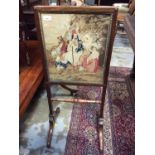 Regency rosewood framed fire screen with tapestry panel depicting Turkish figures on splayed legs