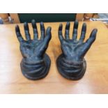 Pair of cast iron hands, cast iron plaque inset with Portuguese ceramic tile, cast iron plaque depic