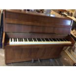 Good quality Kemble iron farmed upright over strung piano in walnut case, supplied by Harrods