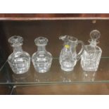 Pair of cut glass decanters together with three further decanters and a cut glass water jug
