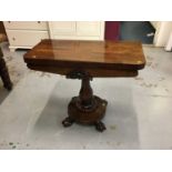 William IV Rosewood card table with fold over top and circular base with carved claw feet