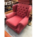 Red button upholstered armchair and a bedroom chair