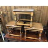 Set of three Ercol elm occasional tables on turned legs joined by stretchers