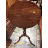 George III mahogany wine table with circular tilt top on turned pedestal with tripod base