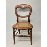 Old bedroom chair with cane seat