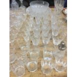 Group of assorted glassware to include cut glass decanters, wines, whisky glasses and others