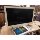 Sony Bravia flatscreen television model number KDL-24EX320, with manual and remote control