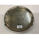 George III silver salver of circular form on three scroll feet, with later engraved decoration, Lond