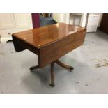 Mahogany pembroke table with end draw on paw feet with brass castors