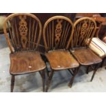 Three elm and oak wheel back chairs