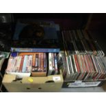 One box of CD's together with a box of DVD's