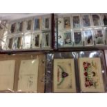 Three albums of cigarette cards and WWI silk postcards
