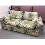 Traditional two seater settee with floral chintz upholstery