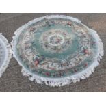 Two circular Chinese rugs with floral decoration, 161cm diameter and 128cm diameter