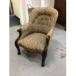 Victorian mahogany framed easy chair with scroll arms and tapestry upholstery with buttoned back