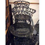 Cast iron garden table with four chairs