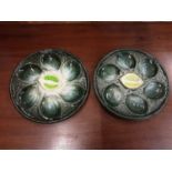 Set of eight 20th century Majolica style oyster plates by St Clement, France