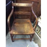 Early 19th century Suffolk elbow chair with ball and bar back, scroll arms, curved solid seat on squ
