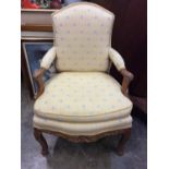 Antique French open arm chair upholstered in Bernard Thorp fabric