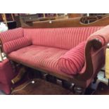 Late Victorian mahogany framed scroll end sofa with red velvet upholstery, on turned legs
