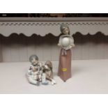 Lladro porcelain figure group of a child with dog and puppies, one other LLadro figure and two simil