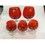 Set of five ruby glass brandy balloons with gilded Napoleonic N and Crown
