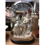 Ceramic figure group under glass dome