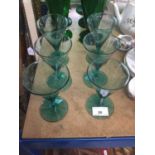 Set of six Bristol green glass glasses together with six green amphora type bottles