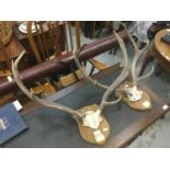 Two set of deer antlers mounted on shields