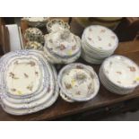 Group of 19th century dinnerware with floral decoration and blue painted borders