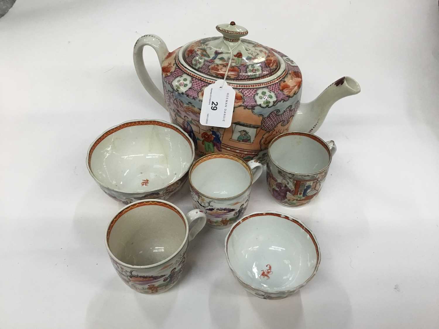 A New Hall 'Boy at the Window' teapot and cover, and three similar coffee cups, a bowl and a tea bow