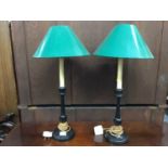 Pair of ebonised table lamps with green shades