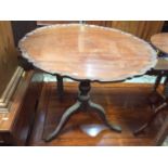 19th century mahogany tilt top pie crust table on carved tripod base