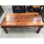Hard wood coffee table with iron strap work. 110cm x 59.5cm