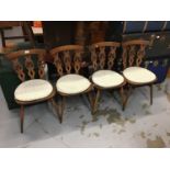 Four Ercol Prince of Wales feather back dining chairs