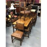 1920s carved oak sideboard, draw-leaf dining table and six chairs