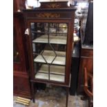 Display cabinet with painted decoration and glazed door