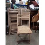 Twenty antique pitch pine folding chairs