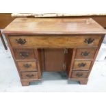 Georgian style mahogany kneehole desk with seven drawers and central cupboard below, 80cm wide, 35cm