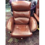 Contemporary brownish red leather revolving reclining armchair