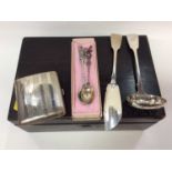 Silver cigarette case, silver fish knife, silver pierced bowl ladle and two white metal souvenir spo