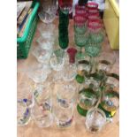 Group of good quality cut glass wares to include cranberry and emerald green glass pieces