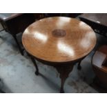Walnut and mahogany centre table with circular top on carved cabriole legs, 75cm diameter