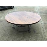 Large circular table on wrought iron base